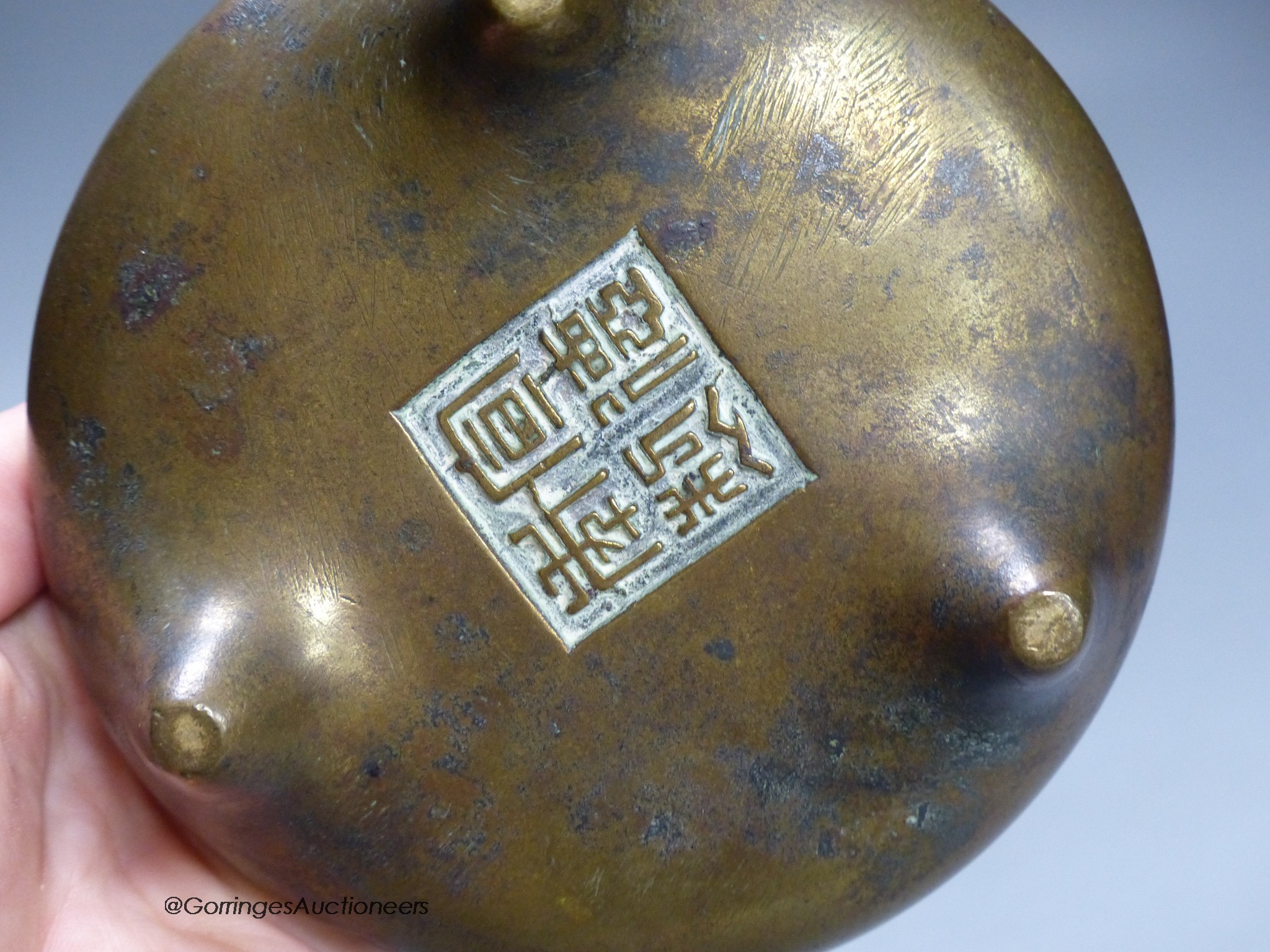 A 19th century Chinese circular bronze tripod censer, diameter 12cm